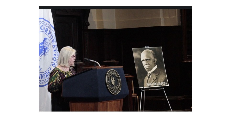 Mary Hoar giving a presentation about John Edward Bruce